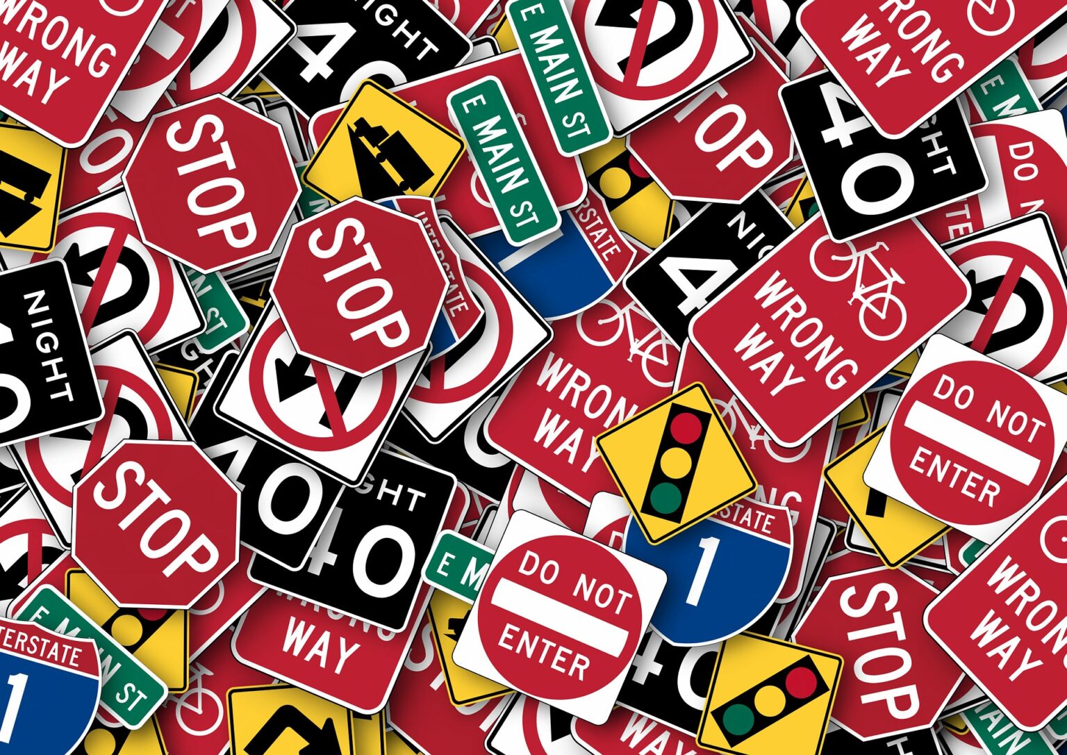 Many traffic signs piled onto each other